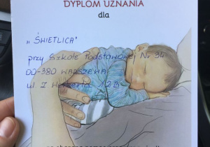 Dyplom uznania dla świetlicy przy Szkole Podstawowej numer 34 w Warszawie za okazaną pomoc.
