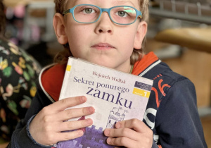 Kacper opowiedział o książce pod tytułem "Sekret ponurego zamku".