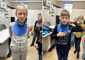 Uczniowie przymierzają fartuchy wypełnione ołowiem, które zakłada osoba towarzysząca pupilowi podczas badania.