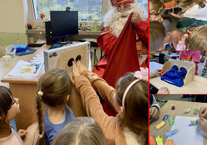 Wizyta Świętego Mikołaja w naszej klasie. Dzieci bawią się prezentami które dostały od Mikołaja.